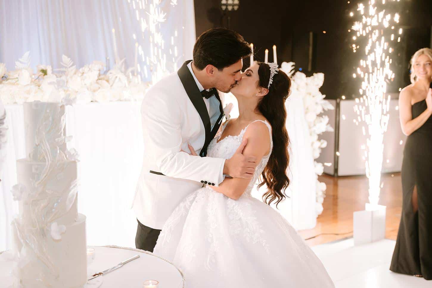 The Greek Club Sparkulars Bride & Groom Cake Cutting Kiss